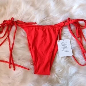 NWT Strange Bikini's skimpy string bottoms